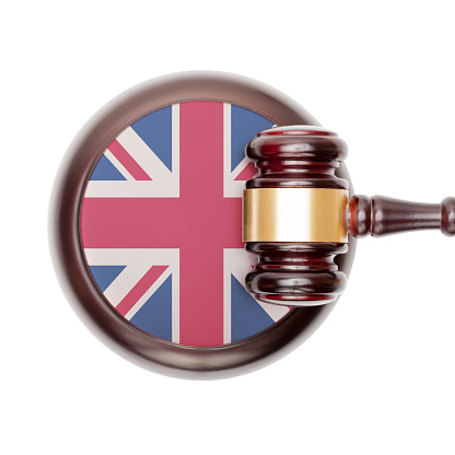 National legal system concept with flag on sound block  - United Kingdom