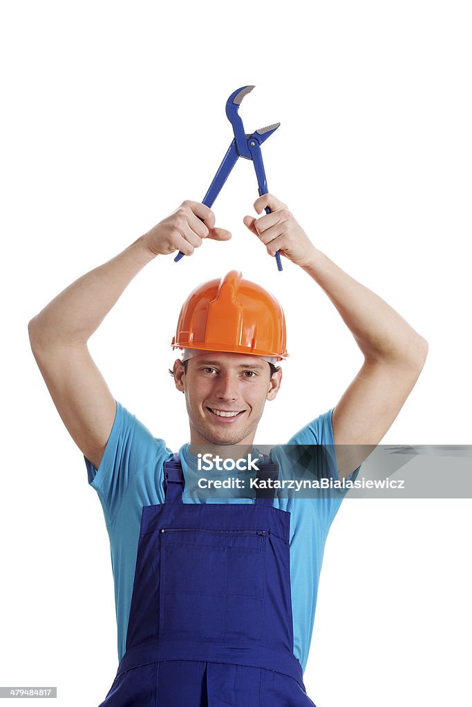 Homme avec clé hydraulique - Photo de Adulte libre de droits