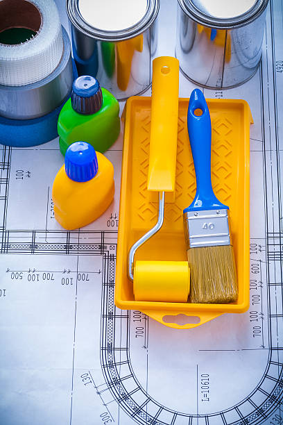 istock Blueprint with paint brush tray roller cans bottles and househol 479489740