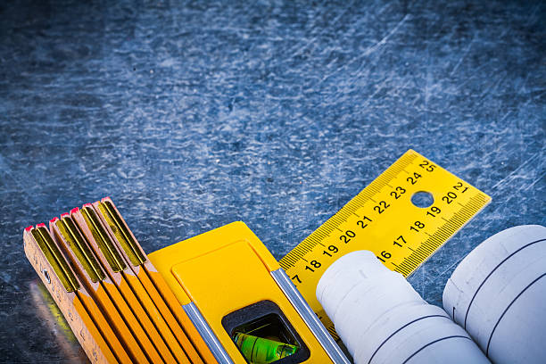 istock Blueprints yellow ruler construction level and wooden meter on m 479489744