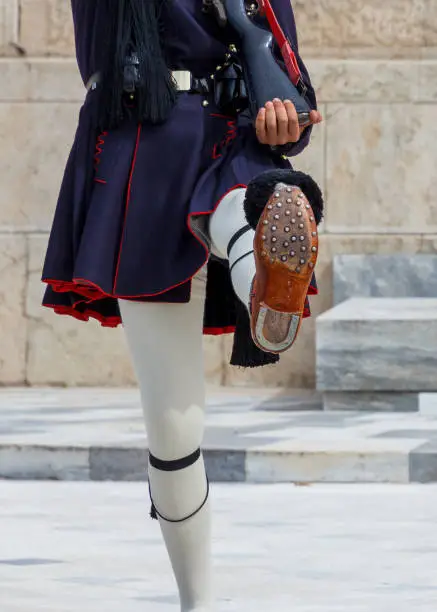 The legs of an Evzone (aka presidential guard, aka tsolias) in Athens, Greece