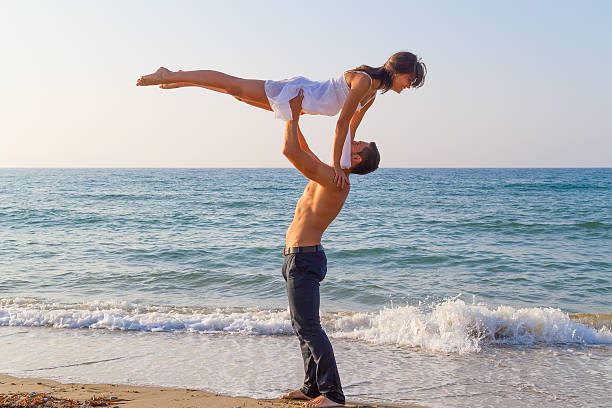 istock Young couple practicing a dance scene at the beach. 479489945