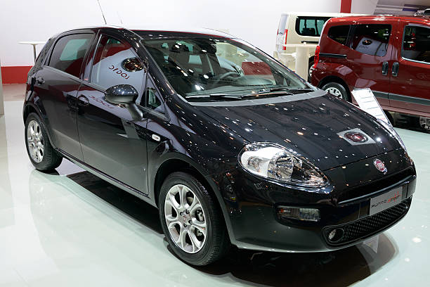 Fiat Grande Punto Brussels, Belgium - January 14, 2014: Fiat Grande Punto compact hatchback on display at the 2014 Brussels motor show. punto stock pictures, royalty-free photos & images
