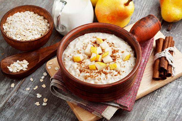 Oatmeal with pear and cinnamon stock photo