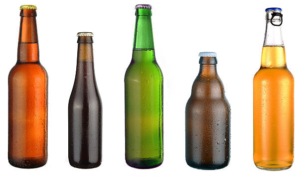 set of beer bottles set of beer bottles on a white background wet bottle stock pictures, royalty-free photos & images