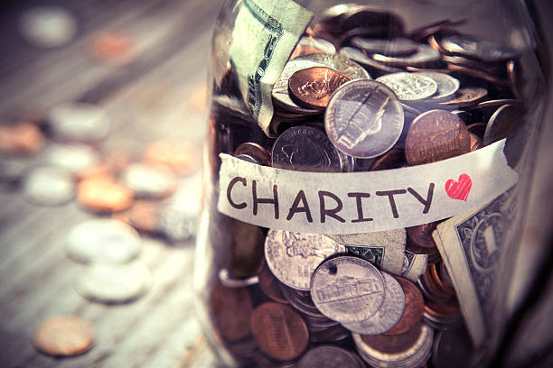 istock Charity jar on rustic wood 479492946