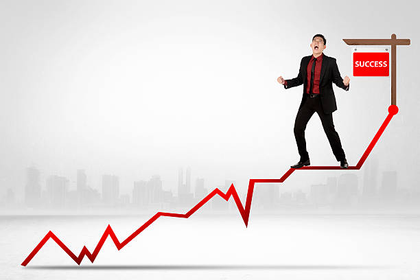 istock Asian business man standing on the chart 479493012