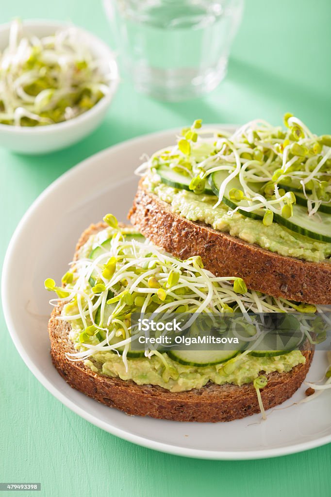 healthy rye bread with avocado cucumber radish sprouts 2015 Stock Photo