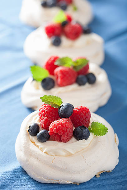 istock pavlova meringue cake with cream and berry 479493988