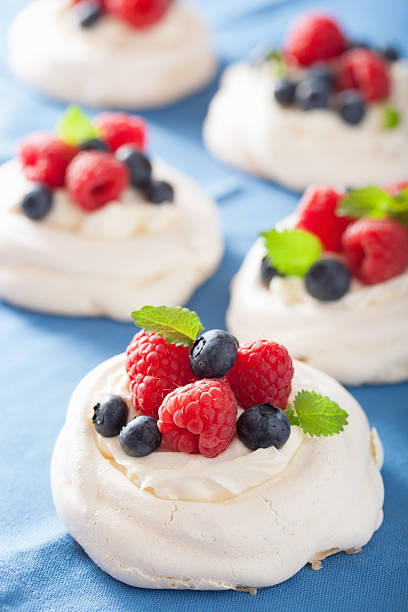 istock pavlova meringue cake with cream and berry 479494008