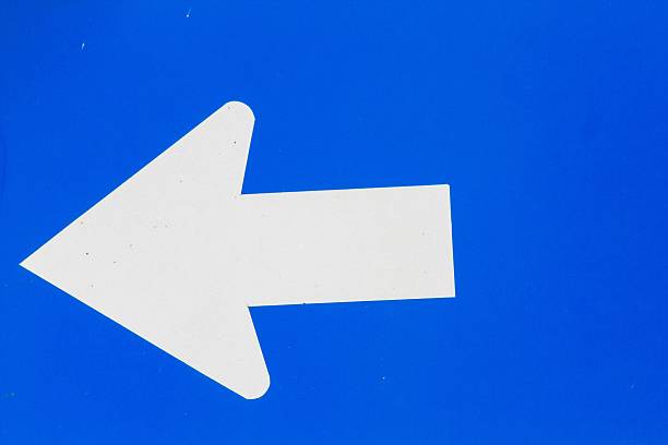 istock blue road sign with white arrow 479494120