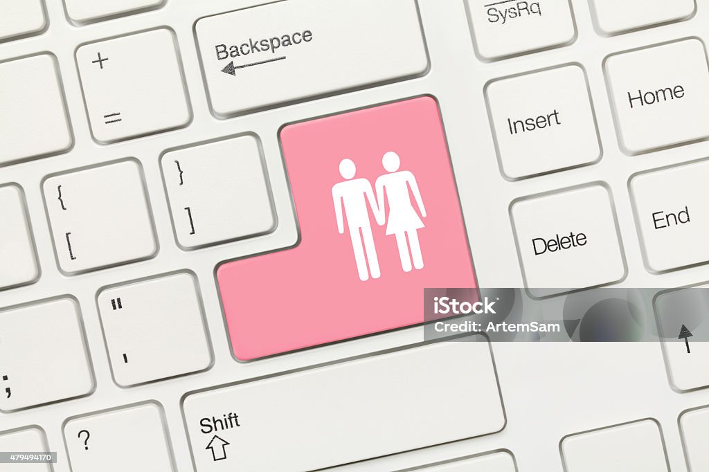 White conceptual keyboard - Couple (pink key) Close-up view on white conceptual keyboard - Couple (pink key) 2015 Stock Photo