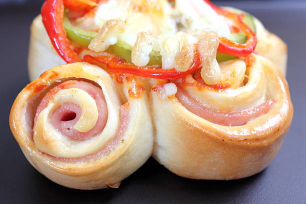 istock Pizza rolls with vegetables, ham and cheese. 479495160
