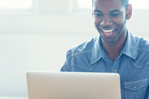 istock African American man working on a laptop computer 479495538