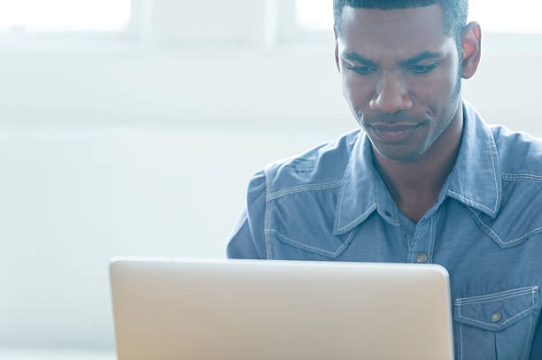 istock African American man working on a laptop computer. 479495540
