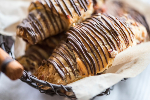 Rugelach with raspberry filling and dark chocolate drizzle, a traditional Jewish pastry