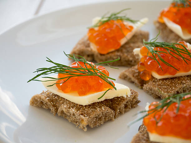 istock Canapes with red caviar and butter closeup 479497634