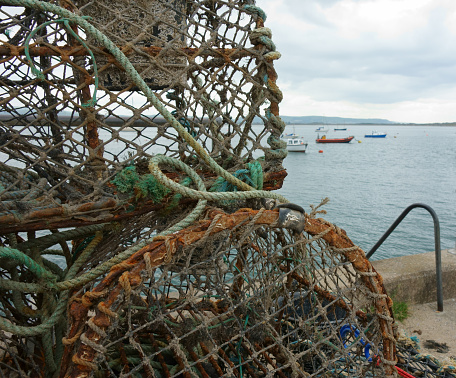 Lobster and crab pots overlooking the sea in  Aberdyfi a small Welsh fishing harbor, Wales,UK. 