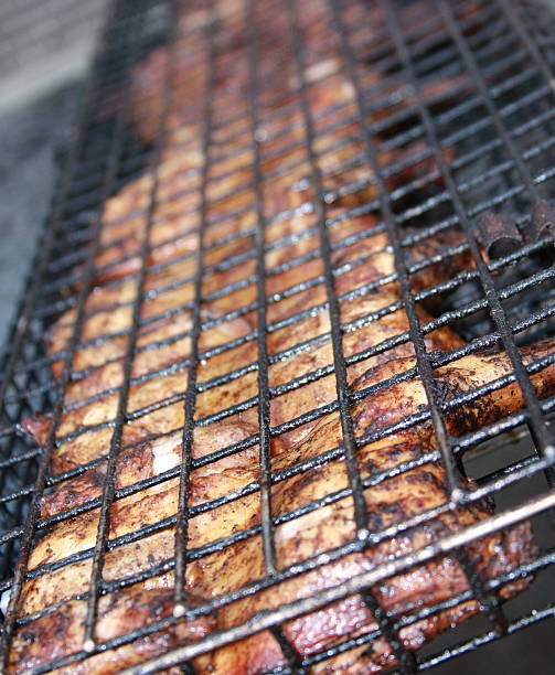 Half Chicken on Grill Rack stock photo