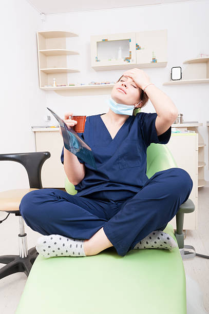 istock Tired dentist doctor having a headache 479501542