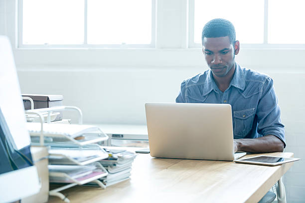 istock African American man working on a laptop computer. 479501972