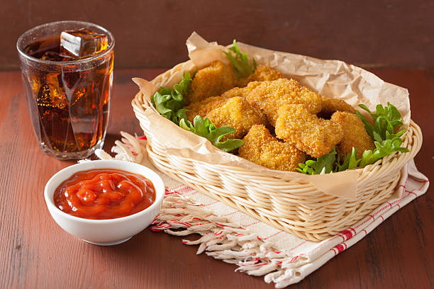 istock fast food chicken nuggets with ketchup, cola 479502016