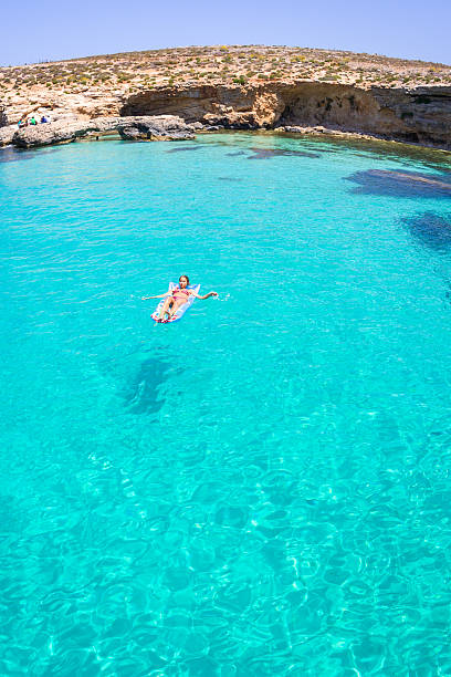istock Young Woman On Clear Blue Mediterranean Water 479502418