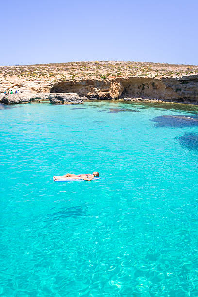 Young Woman On Clear Blue Mediterranean Water stock photo