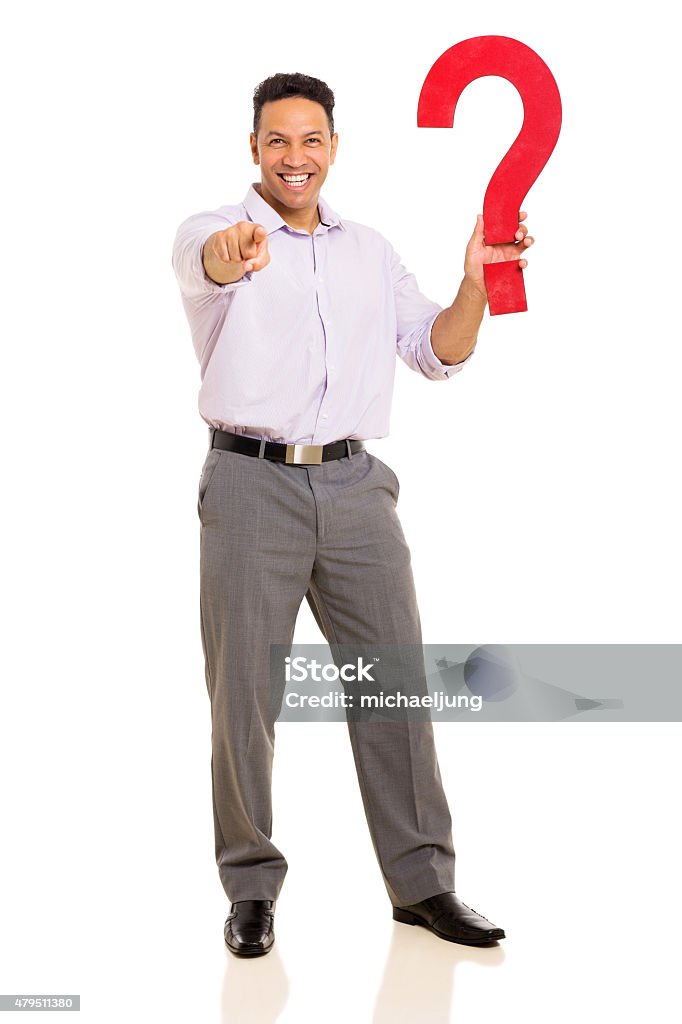 man holding question mark and pointing happy man holding question mark and pointing at the camera 2015 Stock Photo