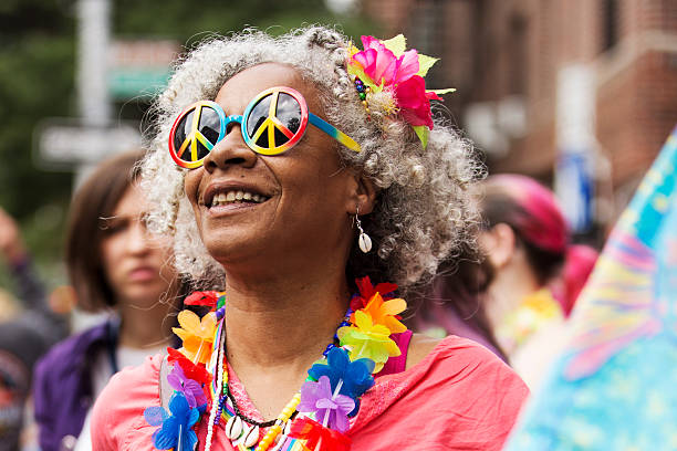 New York, USA - June 28, 2015: Spectators at the Gay Pride Parade in Greenwich Village. Two days after the Supreme Court ruling that the right to same-sex marriage is guaranteed by the Constitution, the New York City Pride Parade which passes by the site where a police raid in 1969 launched the modern Gay Rights Movement carried with it a sense of triumph.