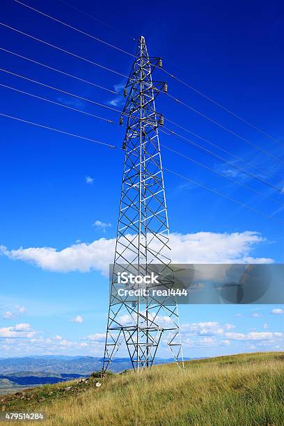 High Voltage Tower Stock Photo - Download Image Now - Blue, Built Structure, Cable