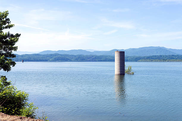 Douglas Lake in Tennessee is not a natural lake as evidenced by  the old silo sticking up through the water. In the background are the Appalachian Mountains.