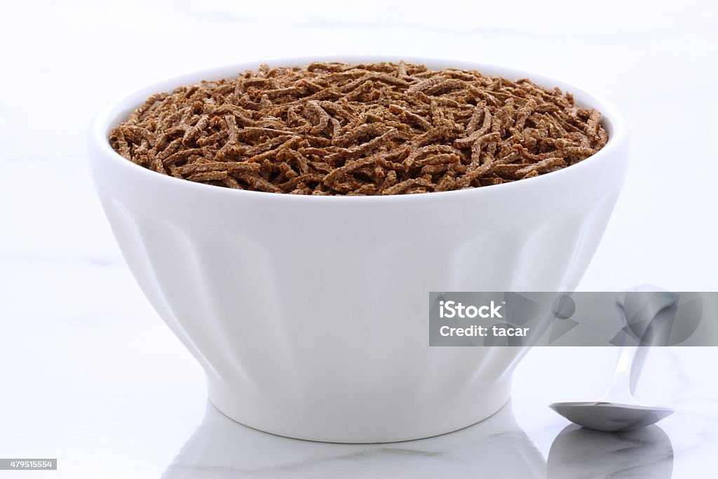 vintage bran cereal breakfast Fresh and delicious wheat bran cereal, on  vintage carrara marble. 2015 Stock Photo