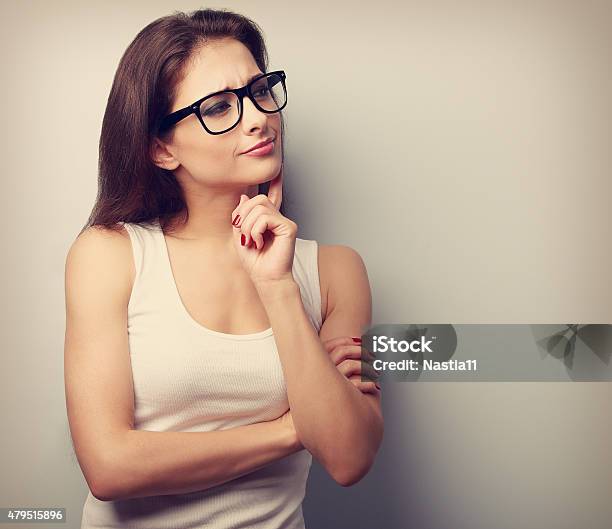 Thinking Serious Young Woman In Glasses Looking Vintage Closeup Stock Photo - Download Image Now