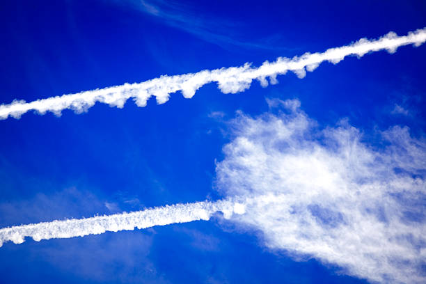 istock traces in the sky from flighters 479518636