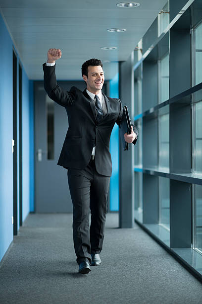 istock happy businessman raising his arm 479519931