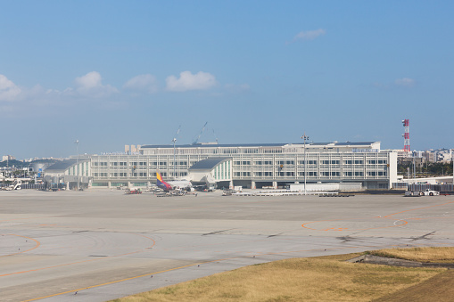 Naha, Japan - January 26, 2015 : Building exterior of Naha Airport International Terminal in Okinawa, Japan. The new international terminal opened in February 2014. 