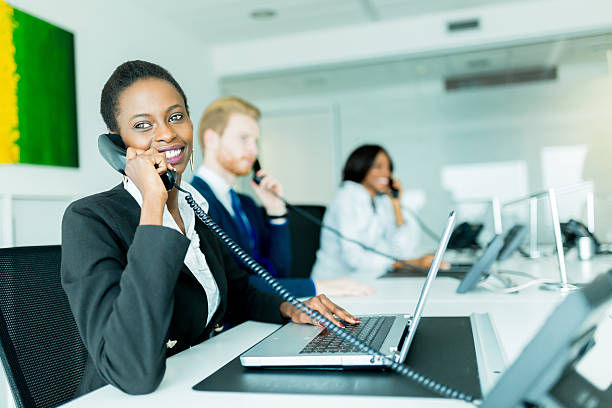 istock Beautiful, black, young woman working at a call center 479520428