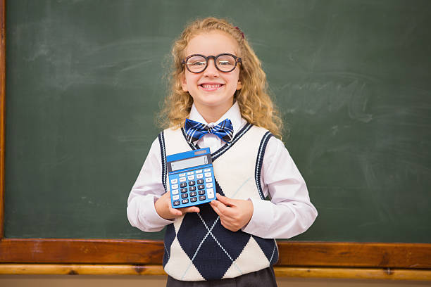 istock Smiling pupil holding calculator 479524838