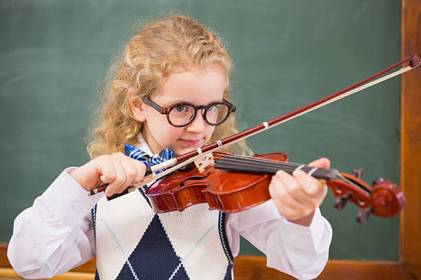 istock Cute pupil playing the violin 479525202