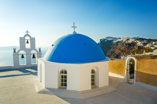 Famous beautiful Orthodox church with blue dome in Firostefani on Santorini island, Greece.