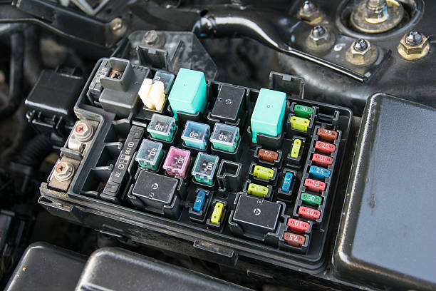 fuse box Detail of a car engine bay with fuses electrical fuse stock pictures, royalty-free photos & images