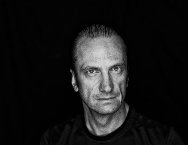 istock Serious man dripping with water and perspiration. Black and White 479526302