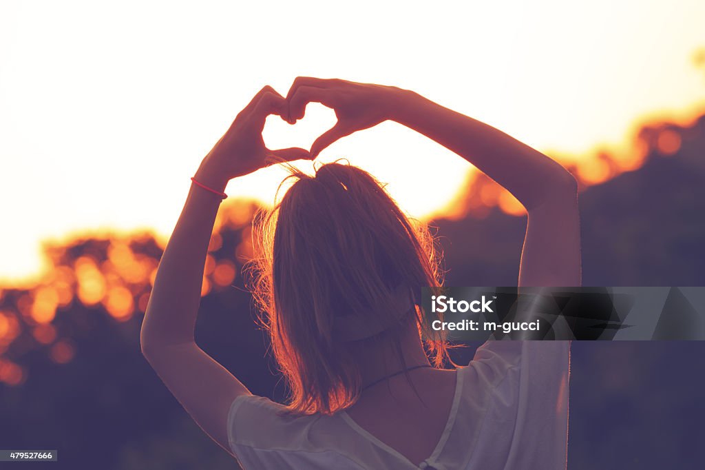 Heart-shape for the sun. Chasing the sun. 2015 Stock Photo