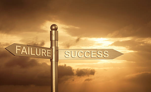 istock roadsign with a failure or success concept and Sunset background. 479527806