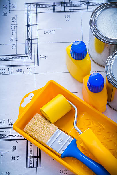 istock Blueprint with paint brush roller tray metal cans and plastic 479527870