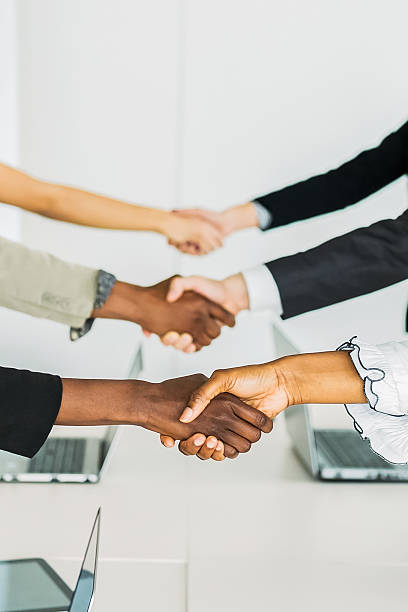 istock Business people shaking hands at the same time 479528158