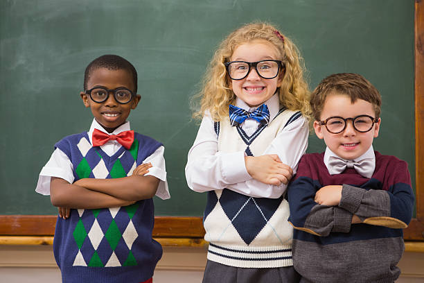 istock Pupils smiling at camera with arms crossed 479528212