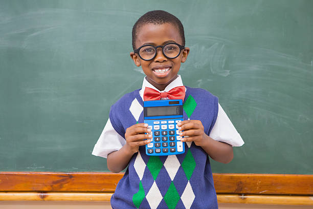istock Happy pupil showing calculator 479528232