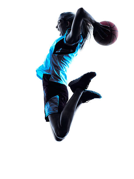 femme silhouette de joueur de basket-ball - womens basketball photos et images de collection